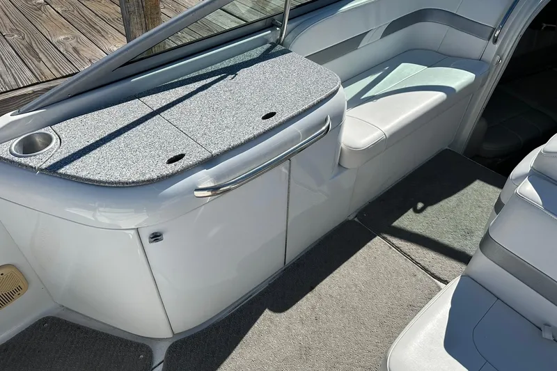 Slide: The Image of 2005 Formula 260 Sun Sport boat interior with seating and storage area. - 10