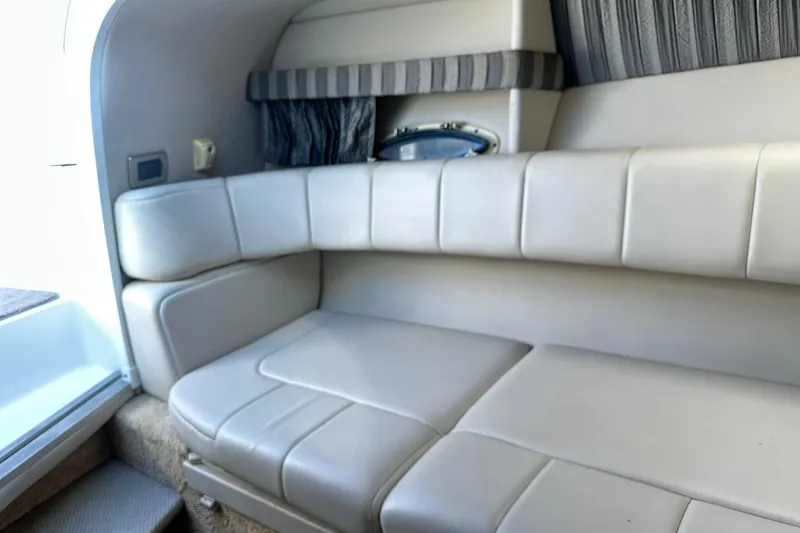 Slide: The Image of 2005 Formula 260 Sun Sport interior with beige leather seating and striped accents. - 18