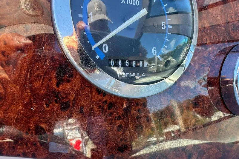 Slide: The Image of Close-up of 2005 Formula 260 Sun Sport tachometer with wood grain dashboard. - 20