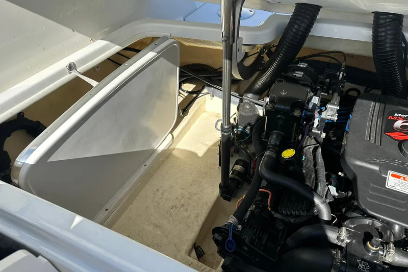 Slide: The Image of Engine compartment of a 2005 Formula 260 Sun Sport boat, featuring a MerCruiser engine. - 22