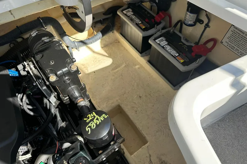 Slide: The Image of Engine compartment of a 2005 Formula 260 Sun Sport boat with dual batteries. - 23