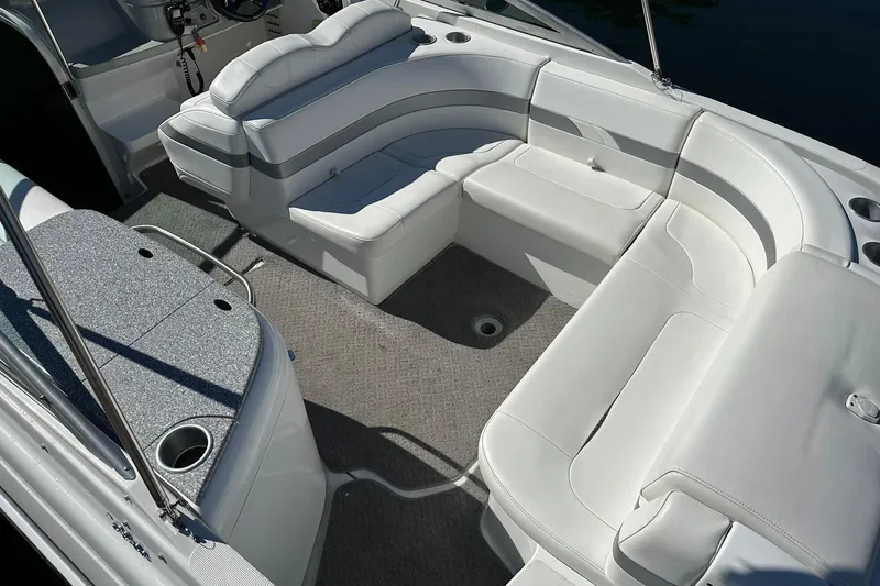 Slide: The Image of 2005 Formula 260 Sun Sport boat interior with white seating and carpeted floor. - 8