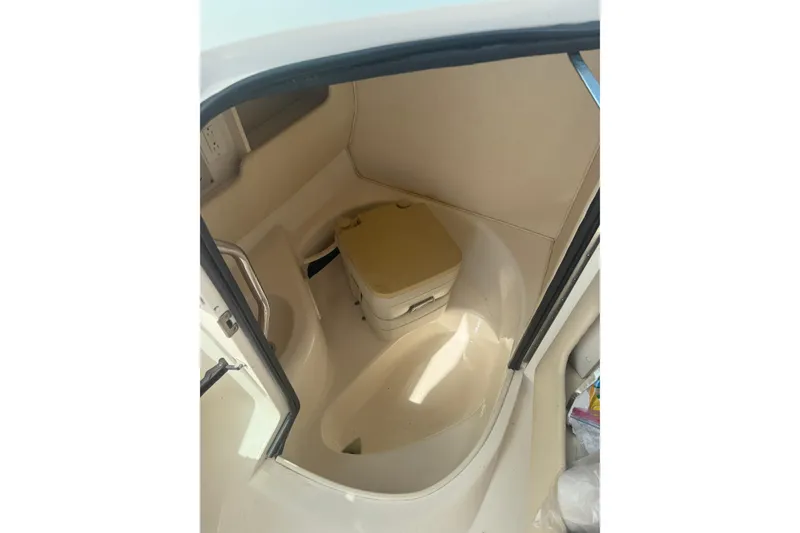 Slide: The Image of 2001 Sea Ray 280 Bow Rider interior cabin with portable toilet. - 12