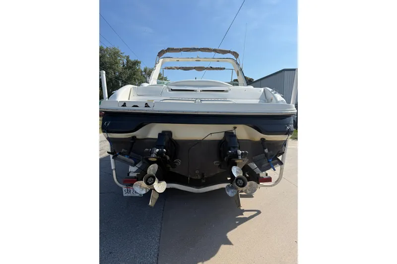 Slide: The Image of Rear view of a 2001 Sea Ray 280 Bow Rider boat with dual propellers. - 19