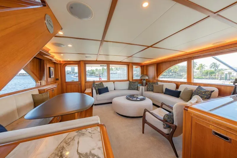 Slide: The Image of Luxurious 1984 Feadship Yacht Fish interior with elegant wood paneling and plush seating. - 10
