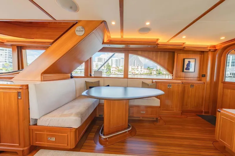 Slide: The Image of Luxurious 1984 Feadship Yacht Fish interior with elegant wood finish and cozy seating area. - 11