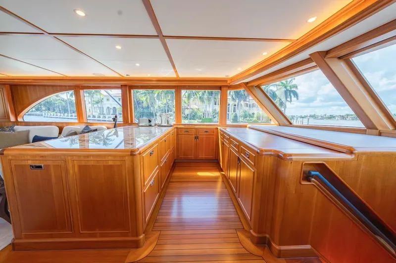 Slide: The Image of Luxurious interior of 1984 Feadship Yacht Fish with wooden cabinetry and panoramic windows. - 14