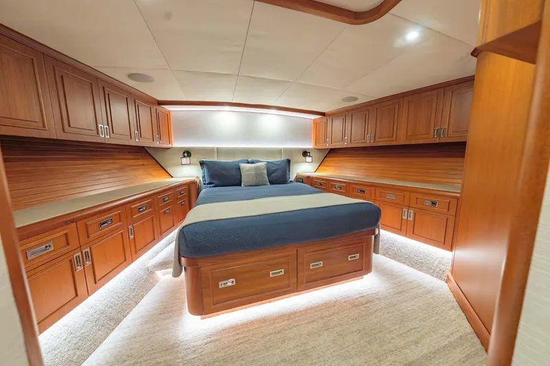 Slide: The Image of Luxurious cabin interior of 1984 Feadship Yacht Fish with wood paneling and cozy bed. - 15