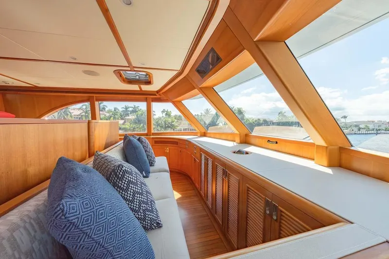 Slide: The Image of Luxurious interior of 1984 Feadship Yacht Fish with wooden accents and plush seating. - 32