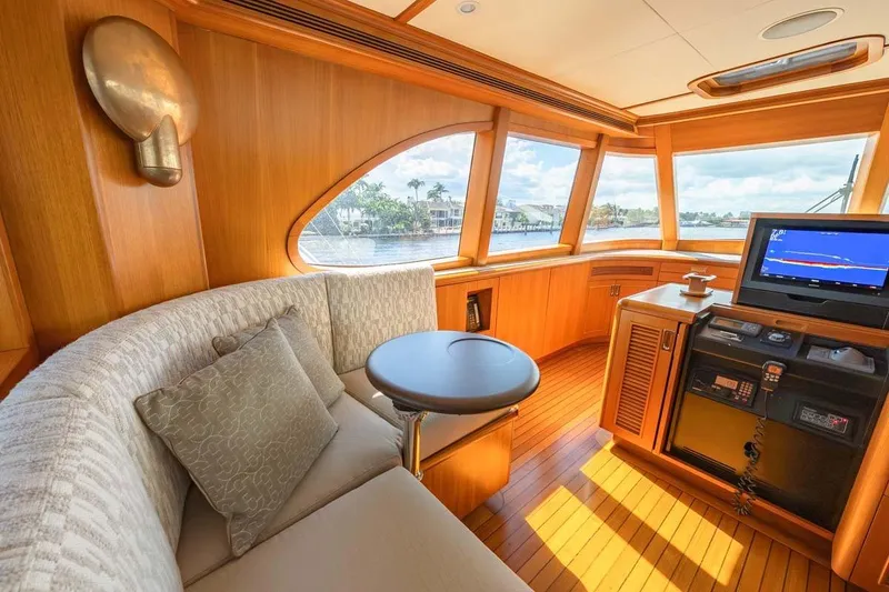 Slide: The Image of Luxurious 1984 Feadship Yacht Fish interior with plush seating and navigation equipment. - 33