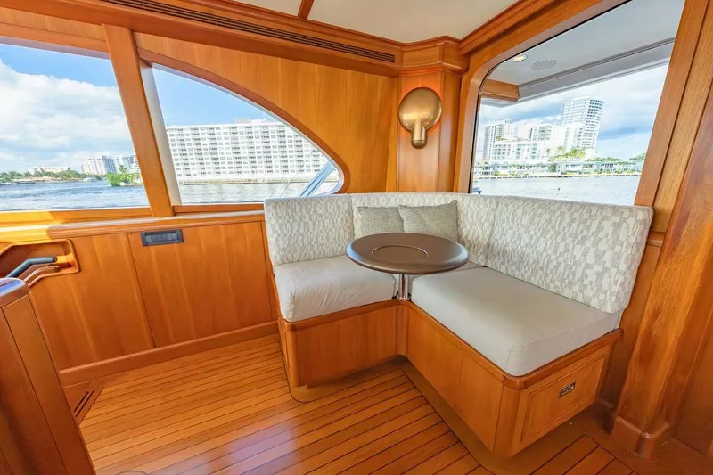 Slide: The Image of Luxurious 1984 Feadship Yacht Fish interior with elegant wood paneling and cozy seating area. - 36