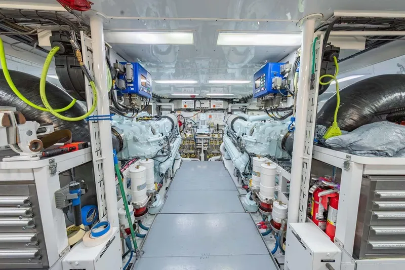 Slide: The Image of Engine room of 1984 Feadship Yacht Fish, featuring advanced machinery and organized tools. - 52