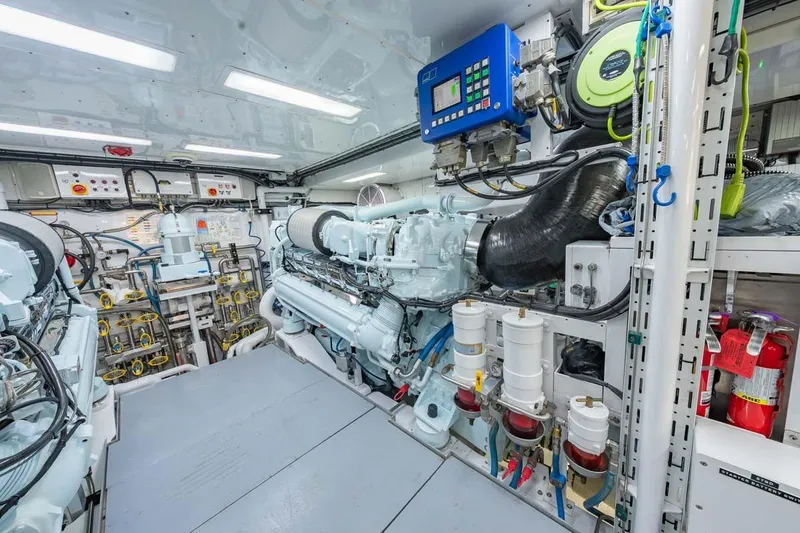 Slide: The Image of Engine room of 1984 Feadship Yacht Fish, showcasing machinery and control systems. - 53