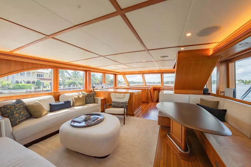 Slide: The Image of Luxurious interior of 1984 Feadship Yacht Fish with elegant seating and panoramic windows. - 7