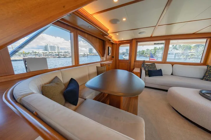 Slide: The Image of Luxurious 1984 Feadship Yacht Fish interior with elegant seating and waterfront views. - 8