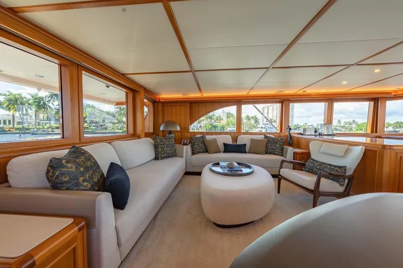 Slide: The Image of Luxurious interior of 1984 Feadship Yacht Fish with elegant seating and panoramic windows. - 9