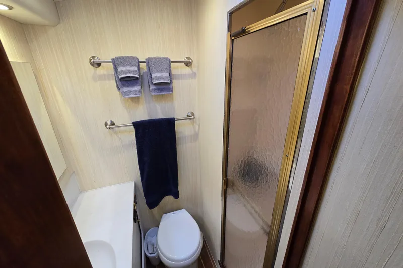 Slide: The Image of Bathroom interior of Ocean Yachts 55 Super Sport, featuring shower and towels, 1982 model. - 25