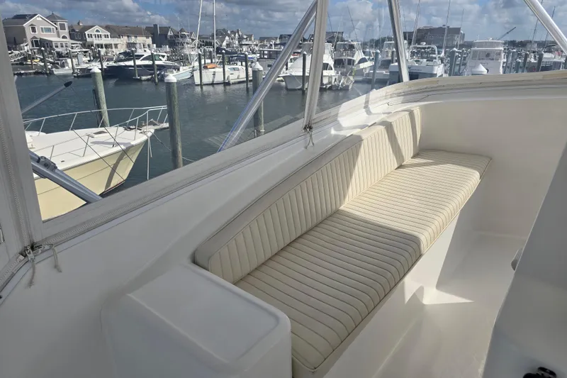 Slide: The Image of Luxurious seating on Ocean Yachts 55 Super Sport, 1982 model, docked at a marina. - 32