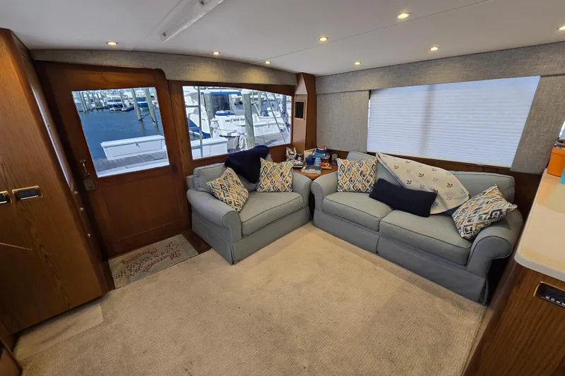 Slide: The Image of Luxurious interior of 1982 Ocean Yachts 55 Super Sport with cozy seating and nautical decor. - 12
