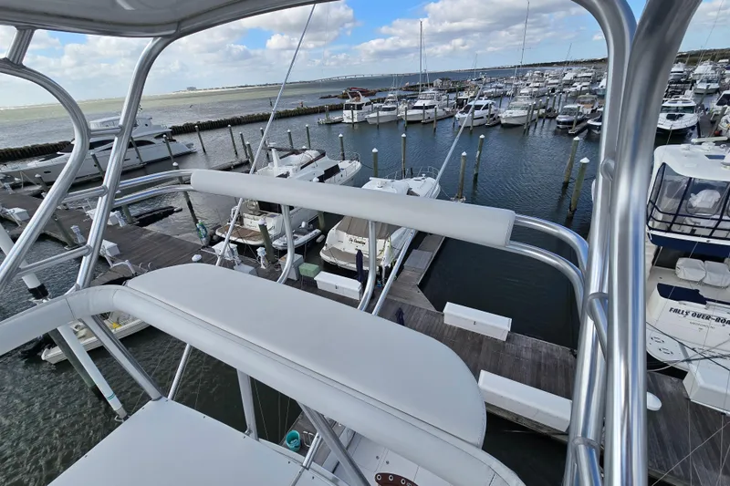 Slide: The Image of View from Ocean Yachts 55 Super Sport 1982, overlooking marina with multiple boats docked. - 37