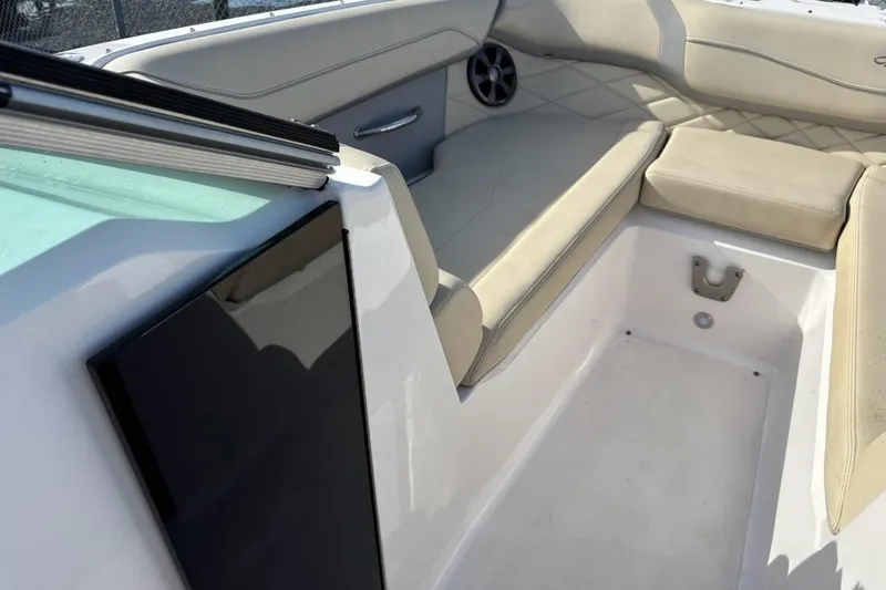 Slide: The Image of 2021 Regal 23 OBX boat interior with beige seating and speaker. - 15
