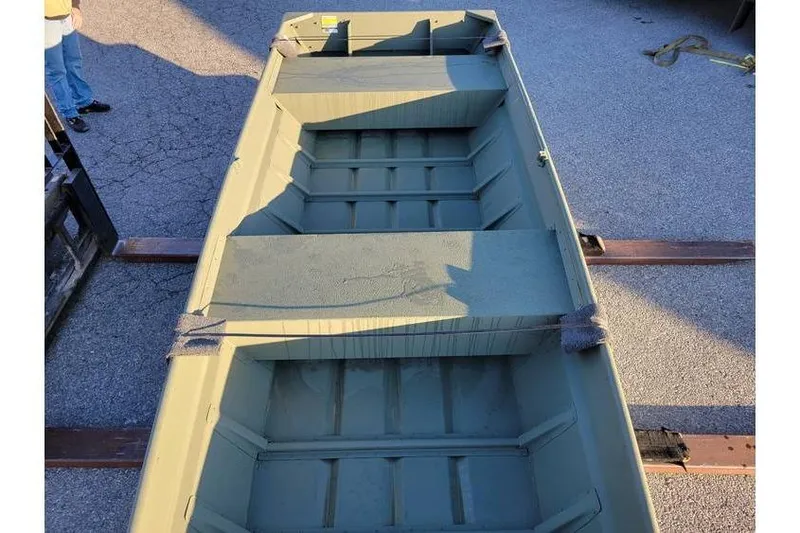 Slide: The Image of 2024 Polar Kraft 1436 Jon Boat, 14-foot, green, on pavement, viewed from above. - 3