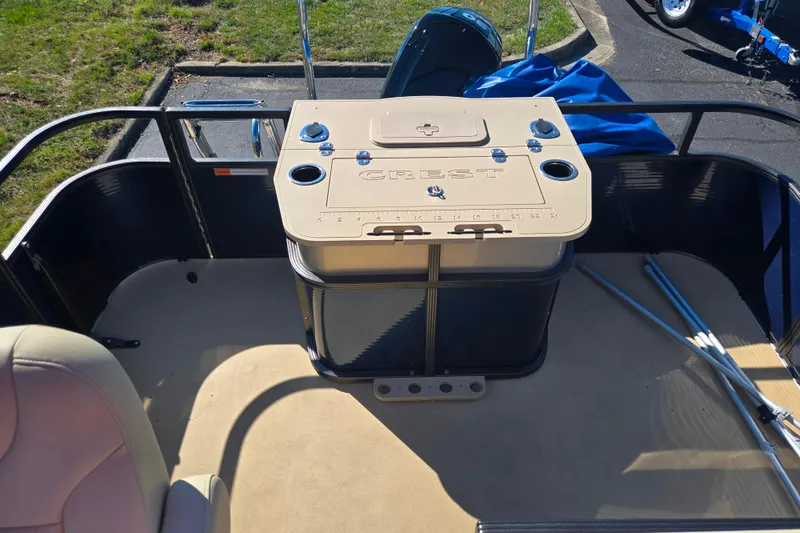 Slide: The Image of 2016 Crest II Fish 210 C4 boat interior with seating and storage compartment. - 15