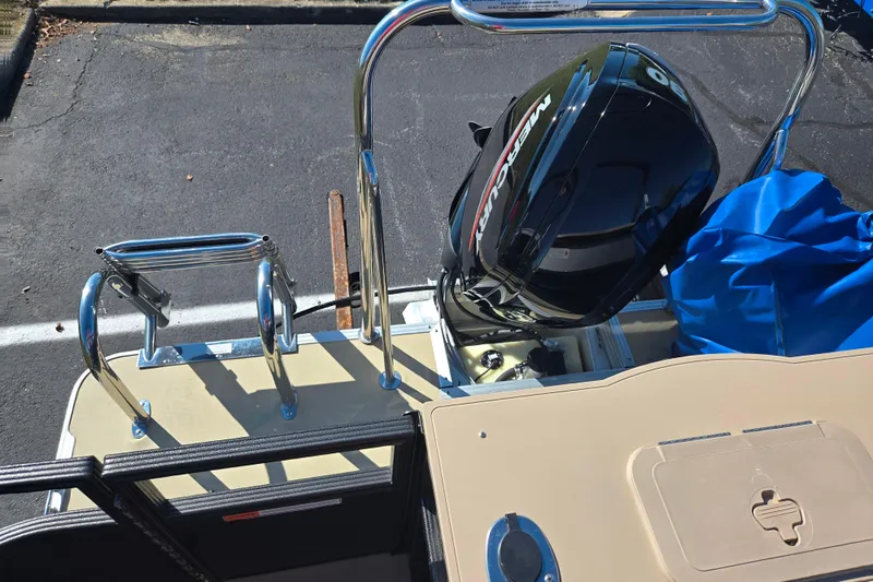 Slide: The Image of 2016 Crest II Fish 210 C4 boat with Mercury outboard motor and blue cover. - 16