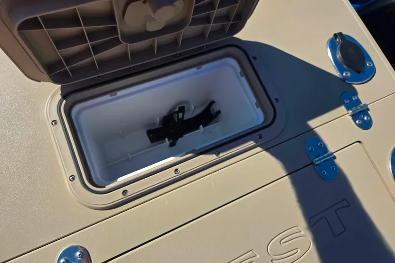 Slide: The Image of Open storage compartment on 2016 Crest II Fish 210 C4 boat. - 18
