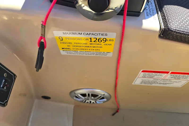 Slide: The Image of 2016 Crest II Fish 210 C4 boat capacity label, 9 persons or 1269 lbs, 90 horsepower. - 22