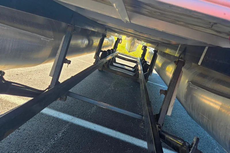 Slide: The Image of Underneath view of a 2016 Crest II Fish 210 C4 pontoon boat on a trailer. - 7