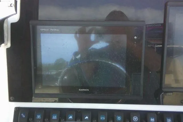 Slide: The Image of Garmin GPS display on 2017 Sea Hunt Ultra 235 SE boat dashboard. - 27