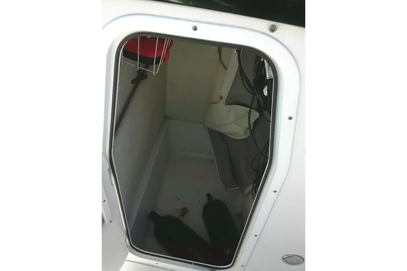 Slide: The Image of Interior view of 2017 Sea Hunt Ultra 235 SE boat storage compartment. - 34