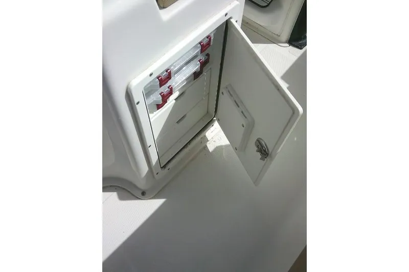 Slide: The Image of Open storage compartment on 2017 Sea Hunt Ultra 235 SE boat. - 38