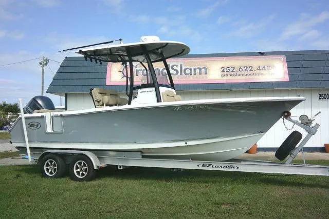 Slide: The Image of 2017 Sea Hunt Ultra 235 SE boat on trailer, parked outside dealership. - 5