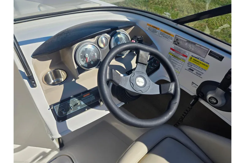 Slide: The Image of 2015 Bayliner 185 Bowrider dashboard with steering wheel and instrument panel. - 14