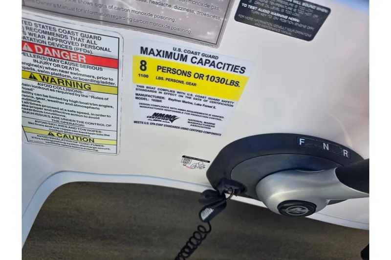 Slide: The Image of 2015 Bayliner 185 Bowrider capacity label, 8 persons or 1030 lbs, safety warnings visible. - 15