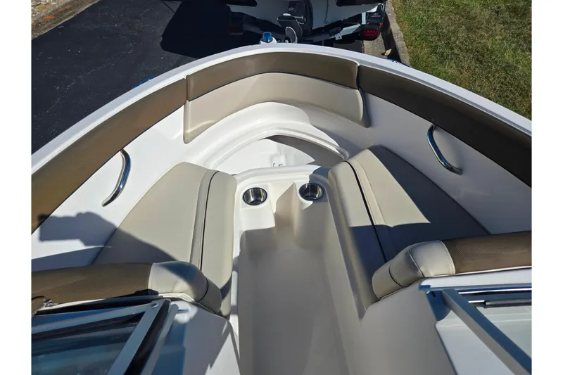 Slide: The Image of 2015 Bayliner 185 Bowrider interior with cushioned seating and cup holders. - 16