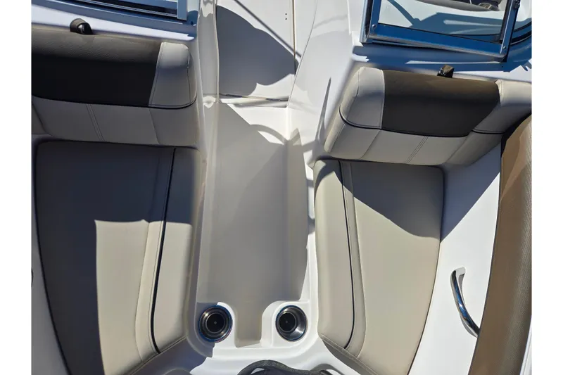 Slide: The Image of 2015 Bayliner 185 Bowrider interior with beige and brown seating, sleek design. - 17
