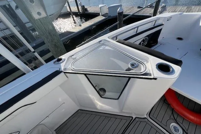 Slide: The Image of 2021 Yama 252 FSH Sport boat storage compartment, open and empty. - 18