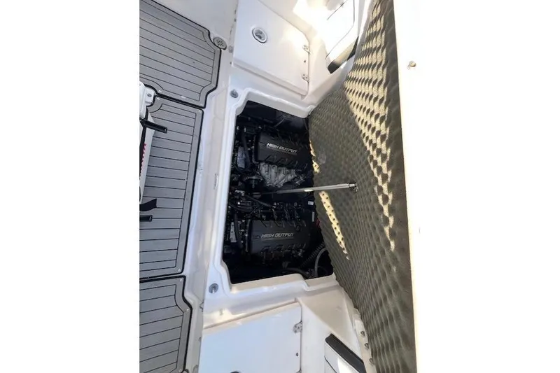 Slide: The Image of 2021 Yama 252 FSH Sport boat deck with seating, on calm water. - 21