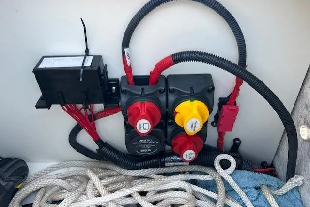 Slide: The Image of Electrical system of a 2021 Yama 252 FSH Sport boat with wiring and switches. - 23