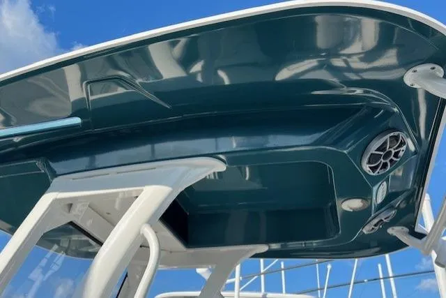 Slide: The Image of 2021 Yama 252 FSH Sport boat canopy with speaker, against blue sky. - 3