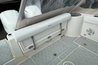 Slide: The Image of 2021 Robalo R300 Center Console boat interior with seating and storage. - 12