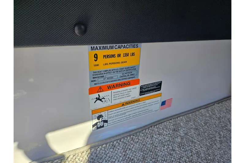 Slide: The Image of 2013 Glastron GT 205 capacity label, maximum 9 persons or 1350 lbs, safety warnings included. - 15