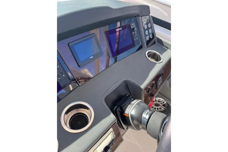 Slide: The Image of Dashboard of 2023 Chaparral 280 OSX boat with modern controls and displays. - 19