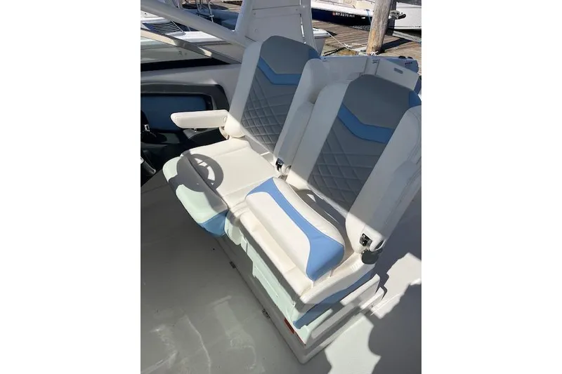 Slide: The Image of 2023 Chaparral 280 OSX boat seats with blue and white upholstery. - 3