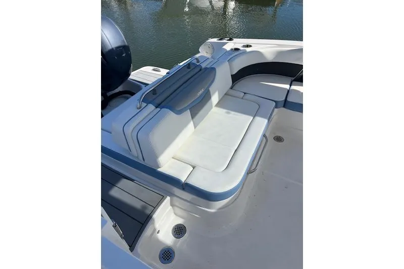 Slide: The Image of 2023 Chaparral 280 OSX boat with comfortable seating and sleek design on the water. - 9