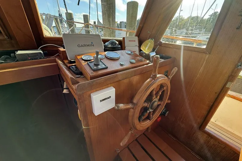 Slide: The Image of 1981 Marine Trader Double Cabin helm with Garmin and Simrad navigation equipment. - 22