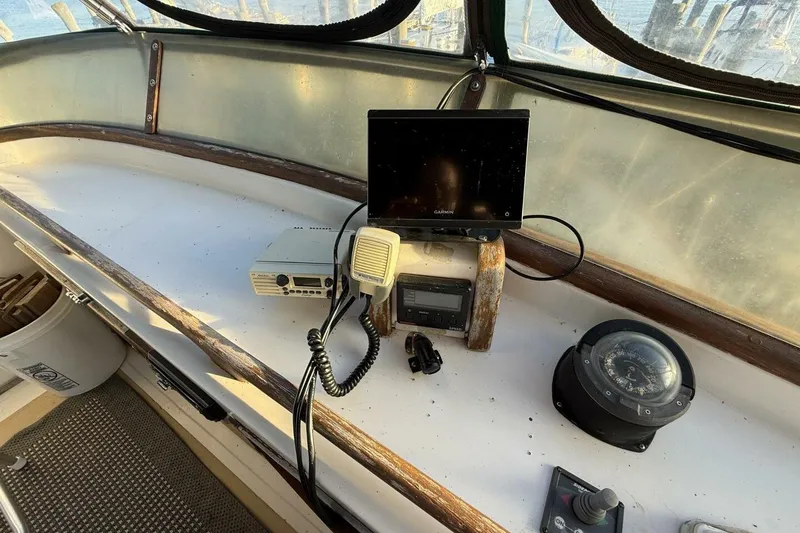 Slide: The Image of 1981 Marine Trader Double Cabin helm with navigation equipment and compass. - 41